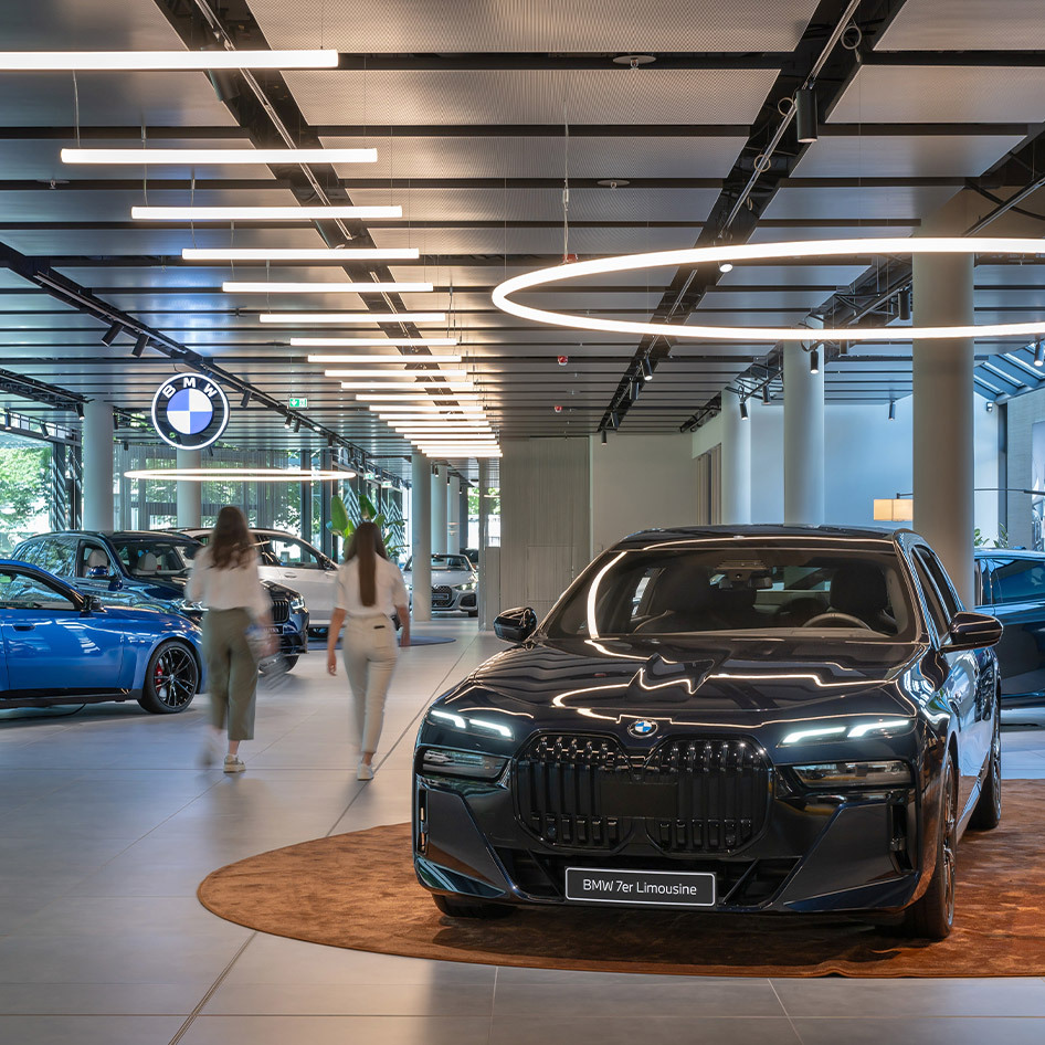 Car inside the BMW branch, illuminated by Alphabet of Light Suspension Circular.