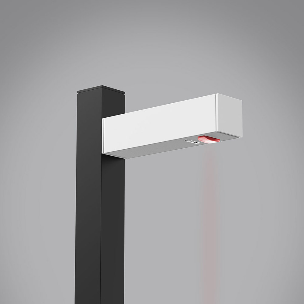 Lampadaire extérieur Artemide : tête LED rectangulaire blanche sur mât carré sombre, émettant un faisceau lumineux dirigé vers le bas