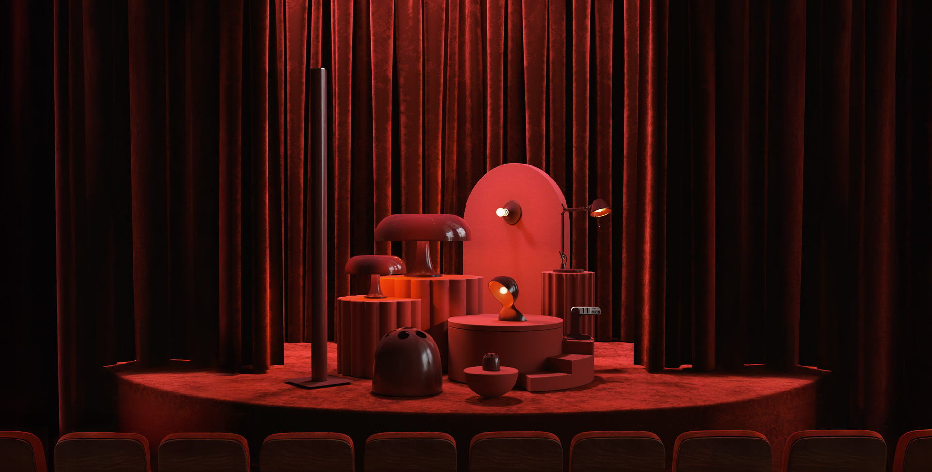 Bordeaux theatrical installation with various Artemide and Danese Milano lamps and design objects on a circular platform in front of velvet curtains.