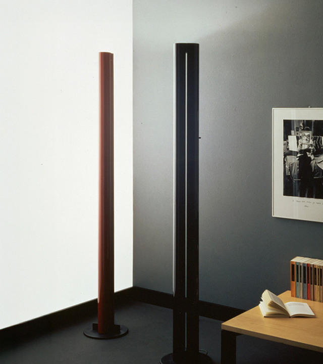 Historic photo of Gianfranco Frattini’s Megaron floor lamp, shown in two finishes within a domestic interior with bookshelf and table.