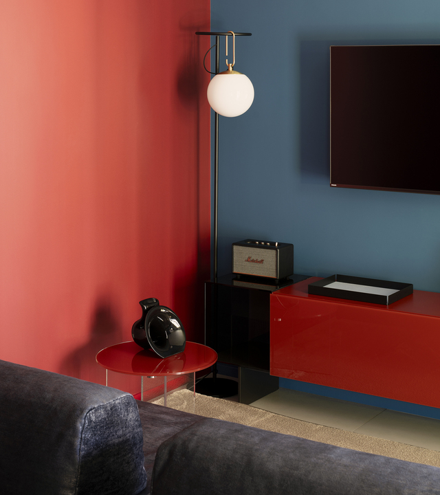 Image of the corner of the living room with an nh floor lamp placed next to the TV cabinet.