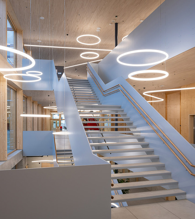 Image of the main staircase with a series of hanging Alphabet of Light