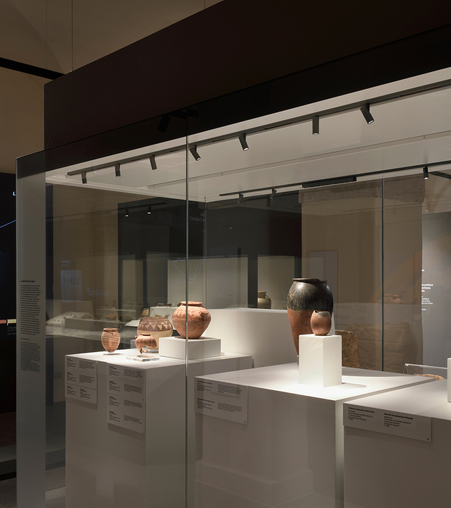 Image of an Egyptian Museum display case illuminated by Turn Around + Vector