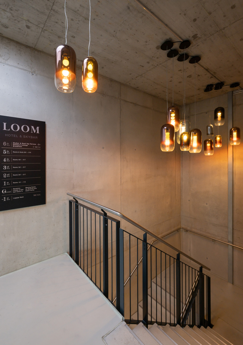 Image of a flight of stairs illuminated with suspension Gople.