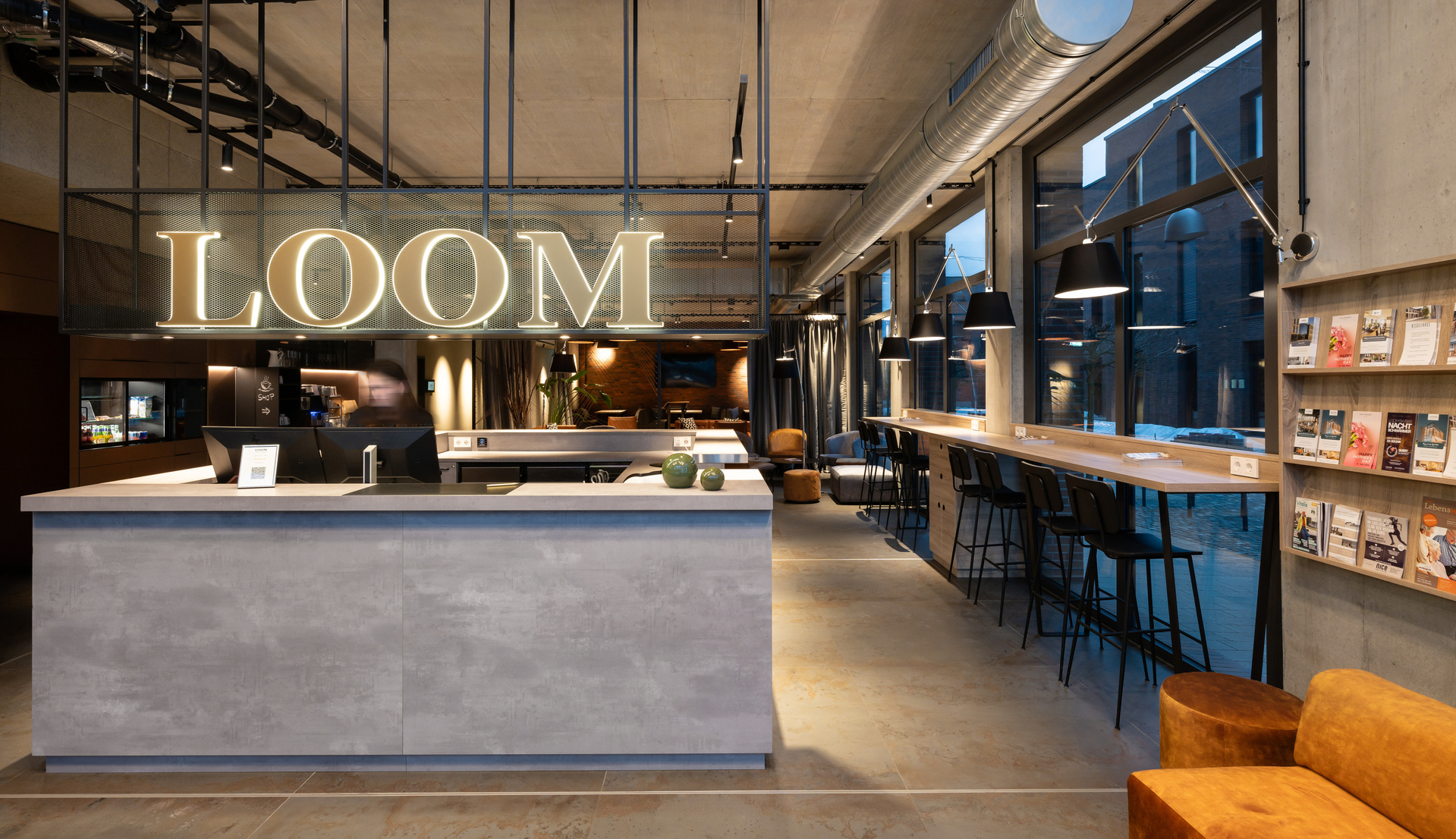 Image of the interior of the cocktail bar illuminated with Tolomeo Mega Wall.